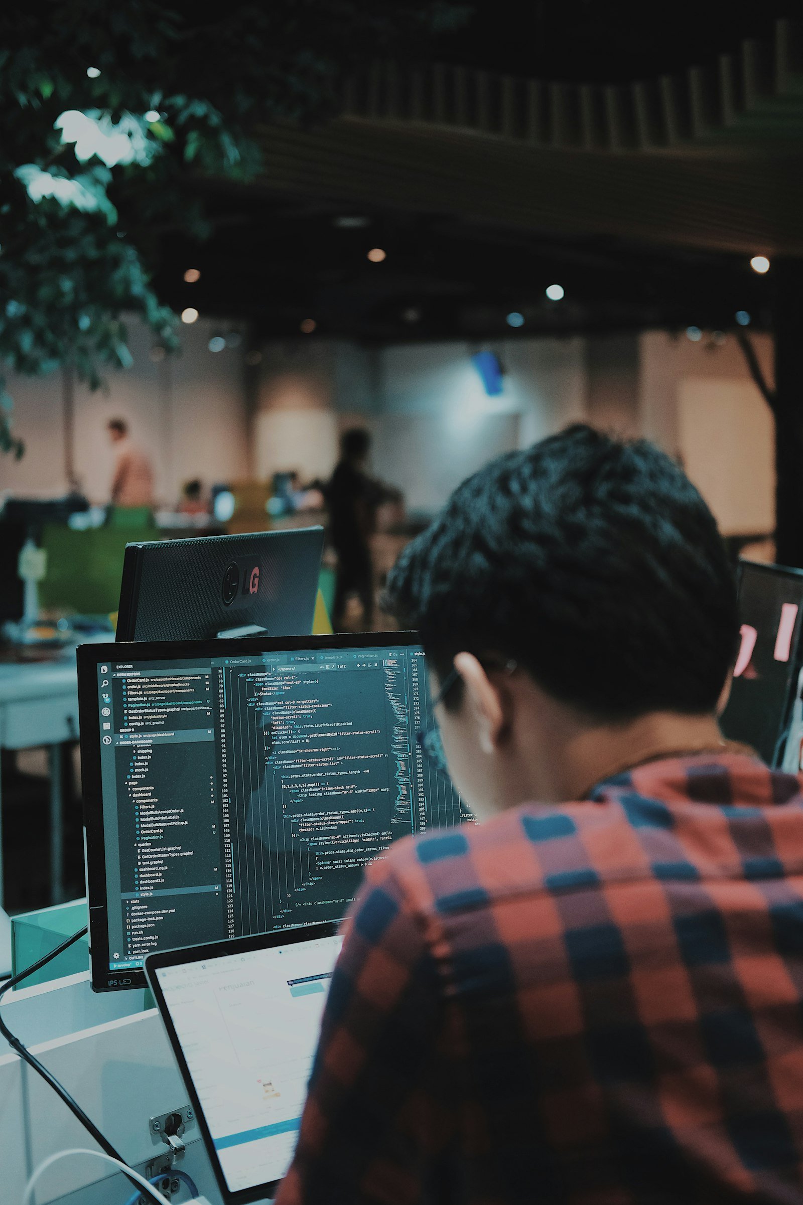 Arif Riyanto. Photo by Arif Riyanto on Unsplash. Source: https://unsplash.com/photos/person-coding-in-modern-workspace-G1N9kDHqBrQ (Unsplash License).