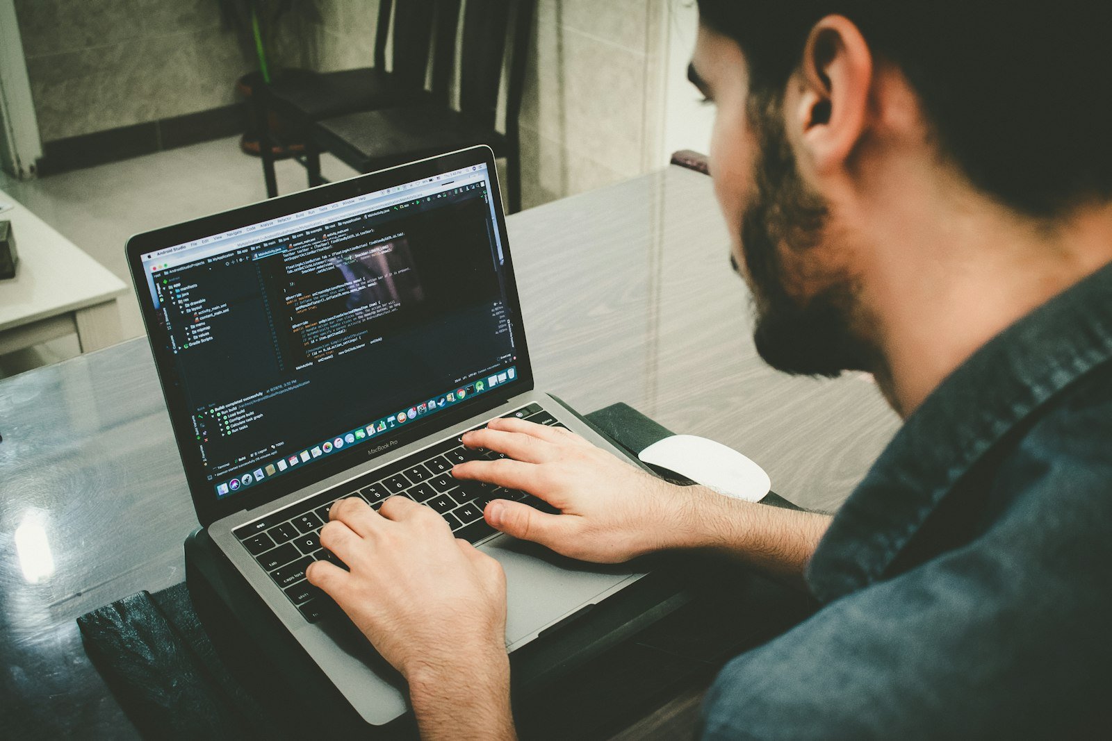 Danial Igdery. Photo by Danial Igdery on Unsplash. Source: https://unsplash.com/photos/man-programming-using-laptop-FCHlYvR5gJI (Unsplash License).