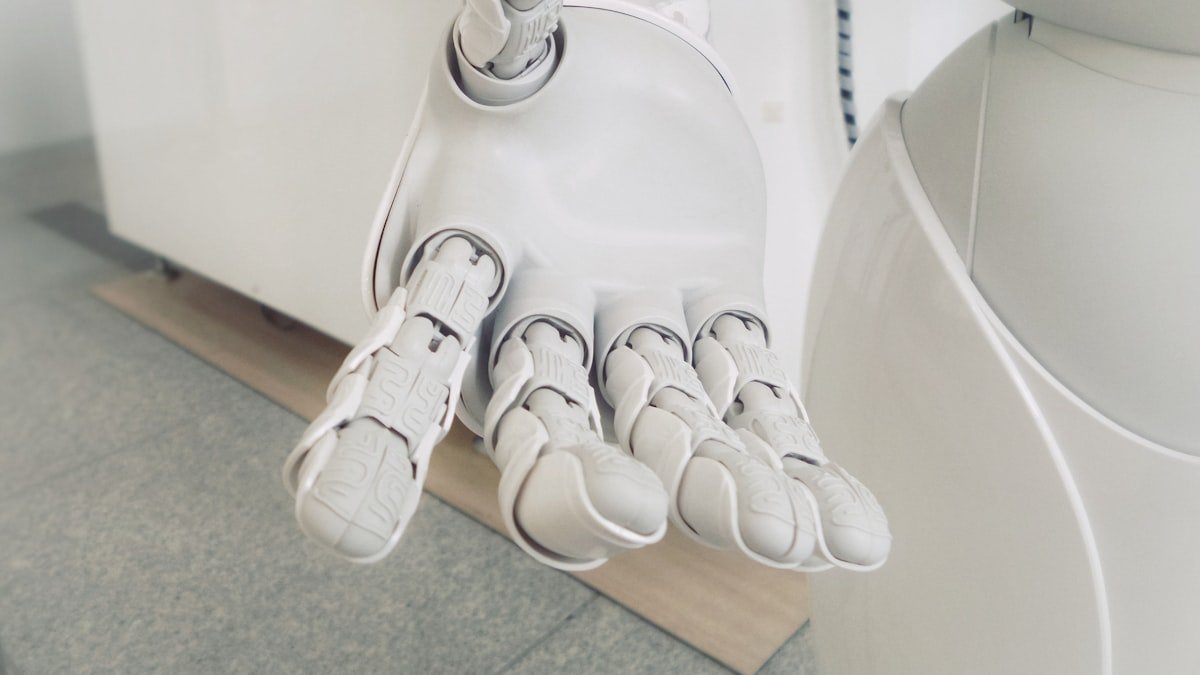 Photo by Franck V. on Unsplash. Source: https://unsplash.com/photos/closeup-photo-of-white-robot-arm-jIBMSMs4_kA (Unsplash License).