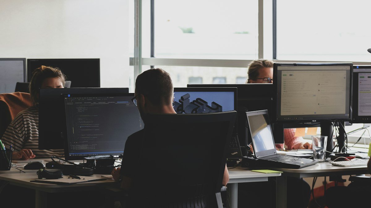 Photo by Compagnons on Unsplash. Source: https://unsplash.com/photos/people-sitting-on-chair-in-front-of-computer-monitor-Fa9b57hffnM (Unsplash License).