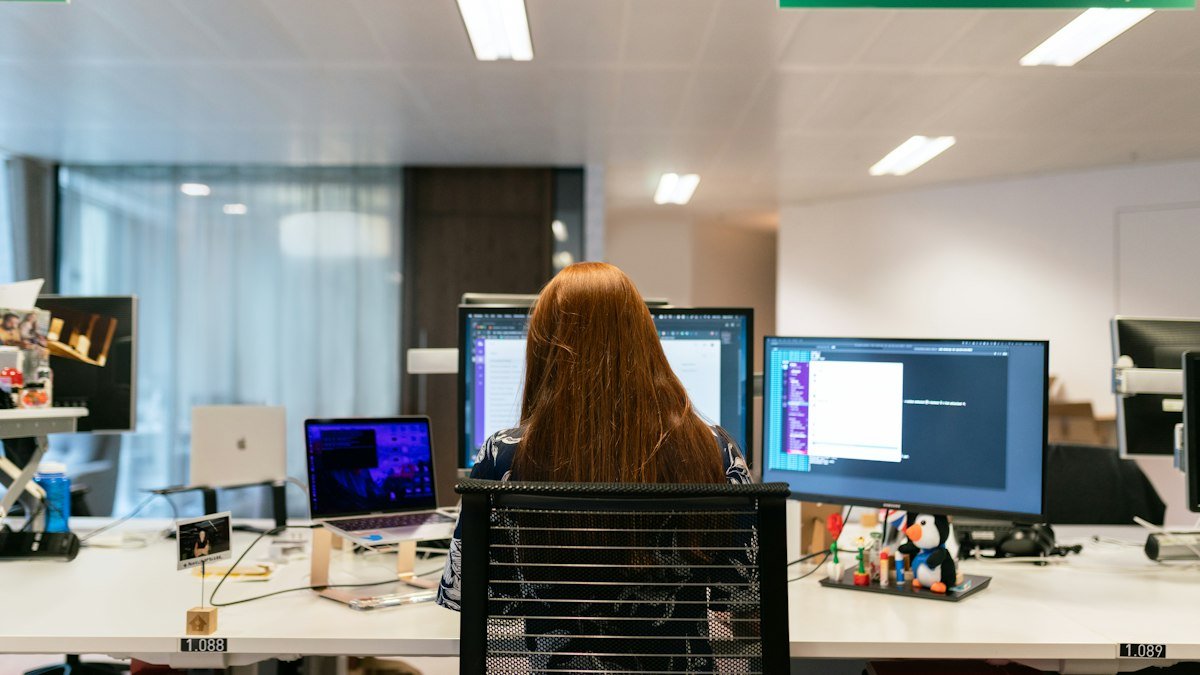 Photo by ThisisEngineering on Unsplash. Source: https://unsplash.com/photos/woman-in-black-shirt-sitting-on-chair-in-front-of-computer-pIdteYOzGFY (Unsplash License).