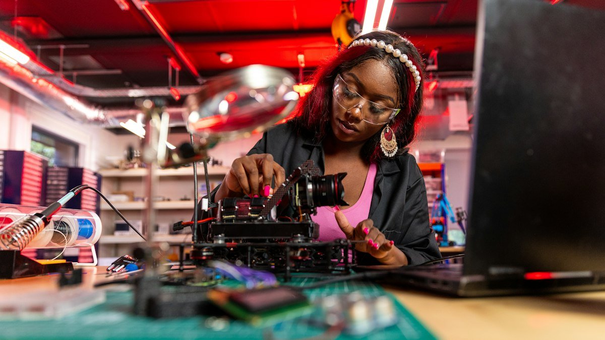 Photo by ThisisEngineering on Unsplash. Source: https://unsplash.com/photos/a-woman-is-working-on-a-machine-in-a-room-hnXf73-K1zo (Unsplash License).