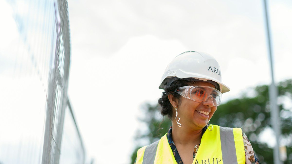 An engineer in a hard hat and safety vest at an infrastructure construction site. Photo by ThisisEngineering on Unsplash. Source: https://unsplash.com/photos/man-in-white-cap-and-yellow-vest-cdSKgXv2Vz4 (Unsplash License).