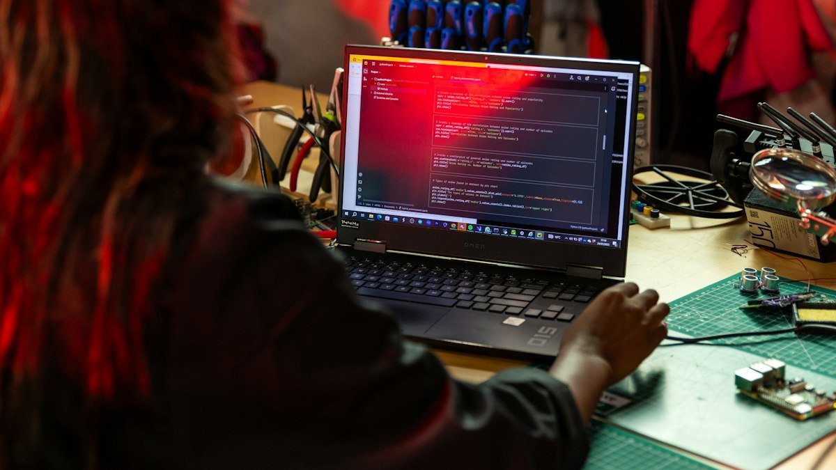 Photo by ThisisEngineering on Unsplash. Source: https://unsplash.com/photos/a-woman-sitting-in-front-of-a-laptop-computer-U-Werwf32CM (Unsplash License).