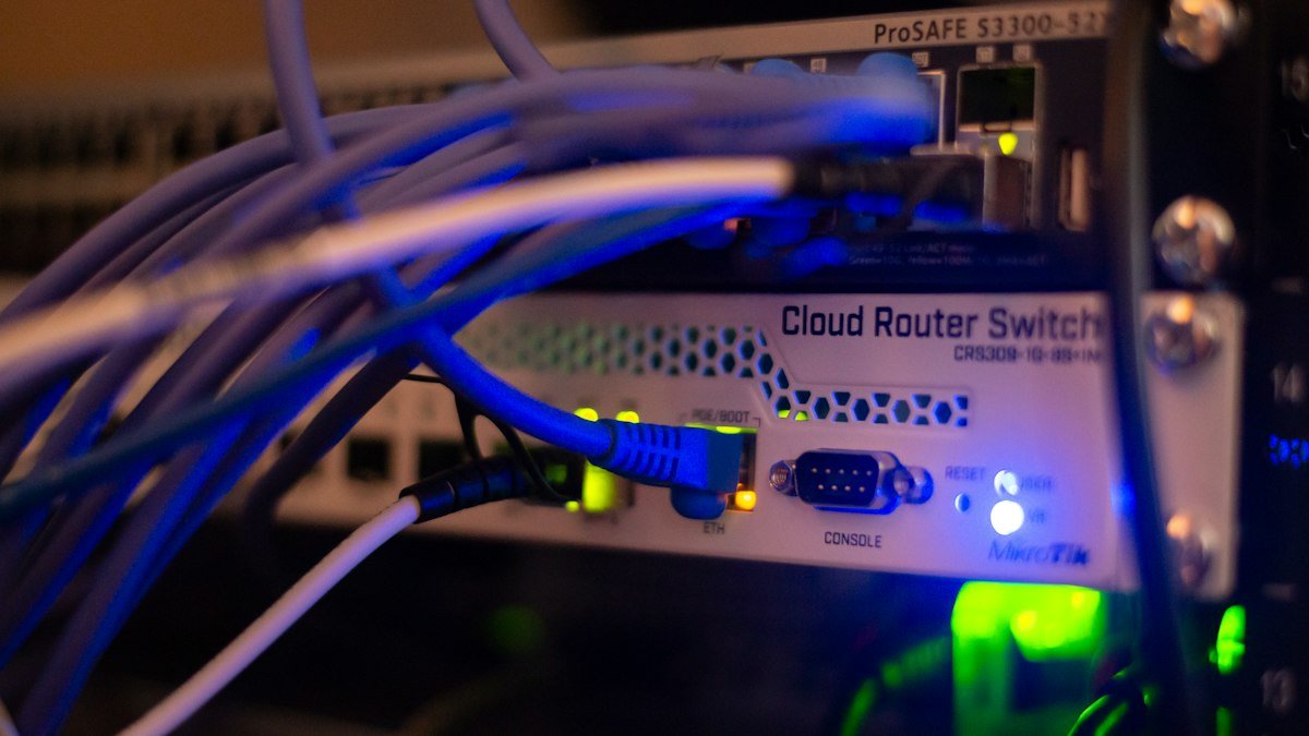 Photo by Albert Stoynov on Unsplash. Source: https://unsplash.com/photos/a-close-up-of-a-network-with-wires-connected-to-it-dyUp7WPu5q4 (Unsplash License).