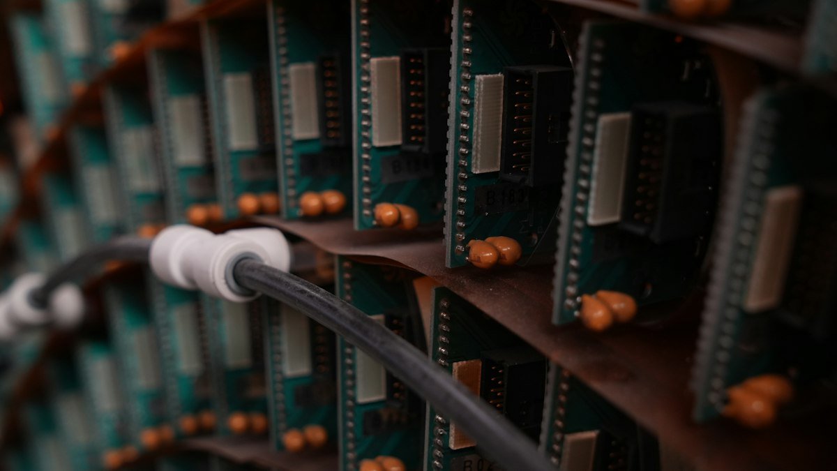 Photo by Daniel Miksha on Unsplash. Source: https://unsplash.com/photos/rows-of-electronic-circuit-boards-with-chips-and-a-cable-UTTS_8YceDk (Unsplash License).