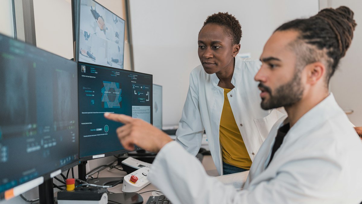 Photo by Accuray on Unsplash. Source: https://unsplash.com/photos/medical-professionals-reviewing-digital-imaging-MFSEP2g4YS0 (Unsplash License).