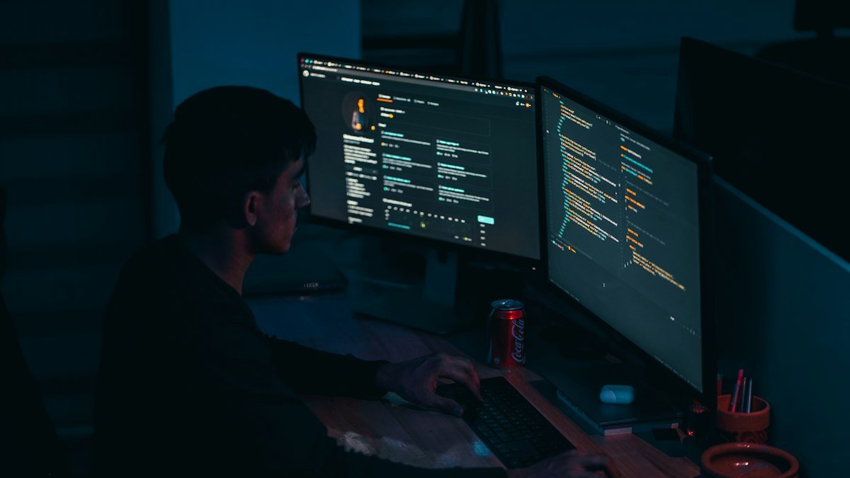 Photo by Mohammad Rahmani on Unsplash. Source: https://unsplash.com/photos/man-in-black-long-sleeve-shirt-using-computer-_Fx34KeqIEw (Unsplash License).