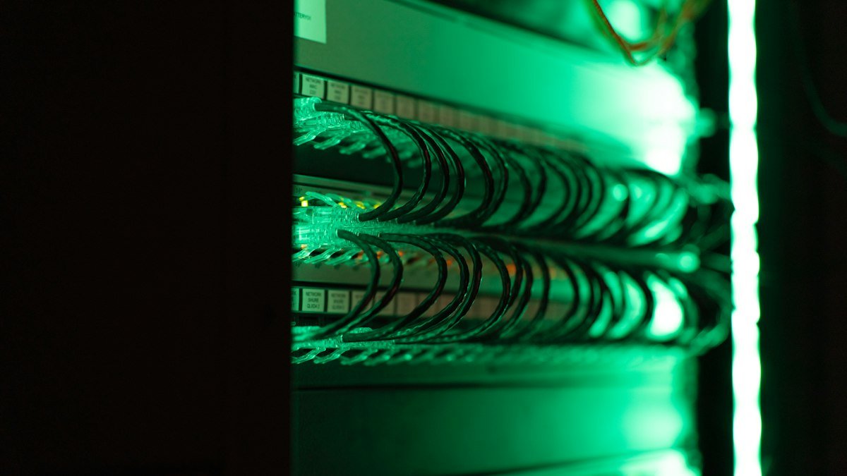 Photo by Tyler on Unsplash. Source: https://unsplash.com/photos/a-close-up-of-a-server-in-a-server-room-vSprjjDbu60 (Unsplash License).