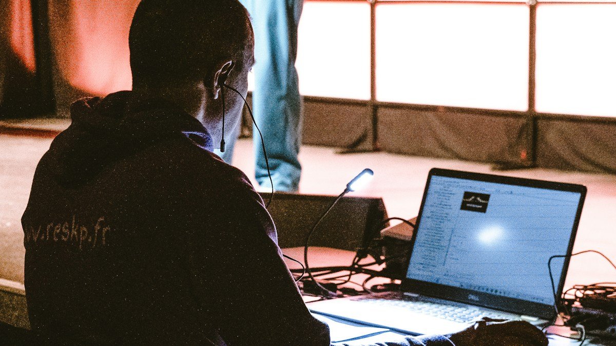 Photo by Jametlene Reskp on Unsplash. Source: https://unsplash.com/photos/man-operating-a-laptop-with-wires-and-equipment-22R9JTd6Nu8 (Unsplash License).