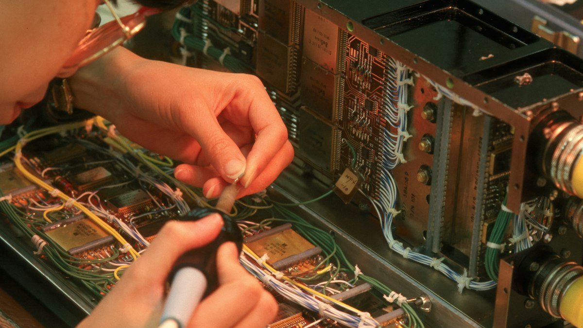 Photo by Community Archives of Belleville and Hastings County on Unsplash. Source: https://unsplash.com/photos/person-working-on-complex-electronic-circuitry-with-wires-Aw33UesQ7ok (Unsplash License).