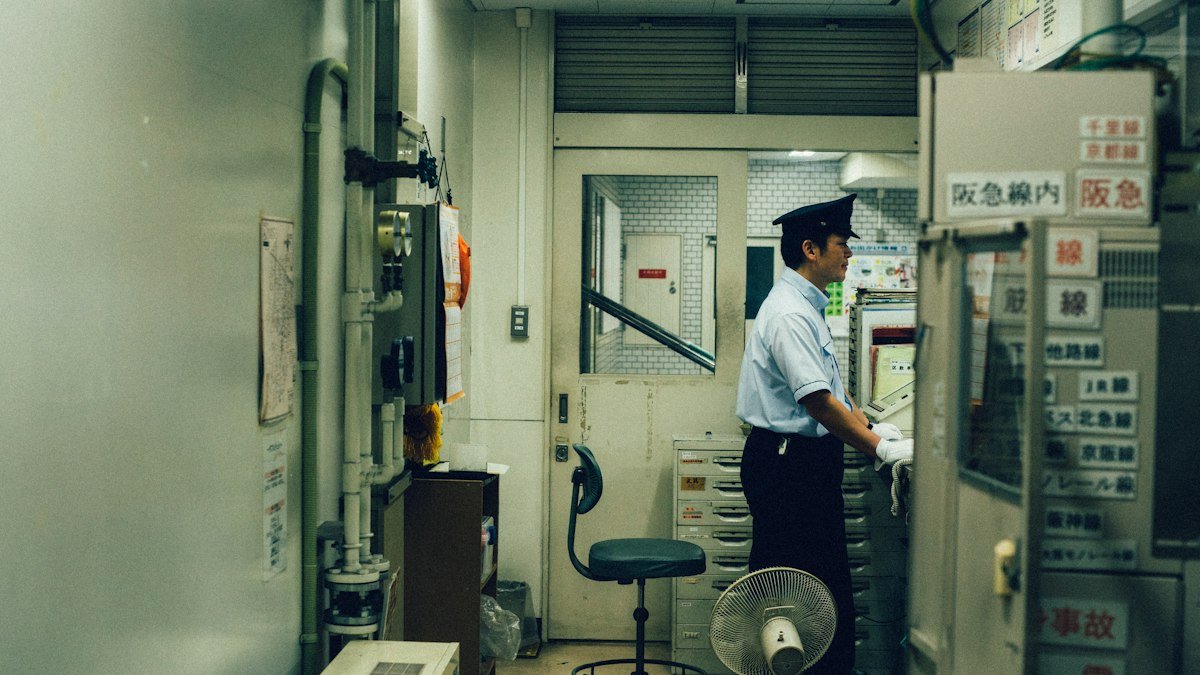 Photo by Andrew Leu on Unsplash. Source: https://unsplash.com/photos/man-standing-near-the-control-panel--6L78OUtJmY (Unsplash License).