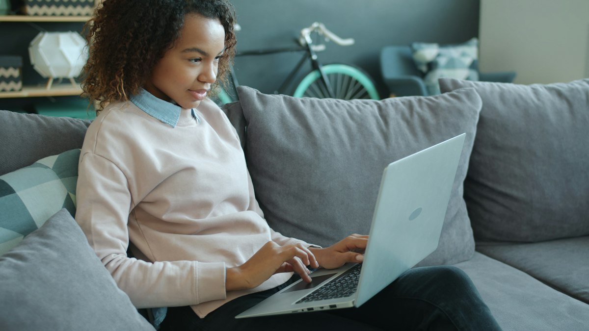 Photo by Vitaly Gariev on Unsplash. Source: https://unsplash.com/photos/woman-working-on-a-laptop-on-a-couch-u3y3918hWm4 (Unsplash License).