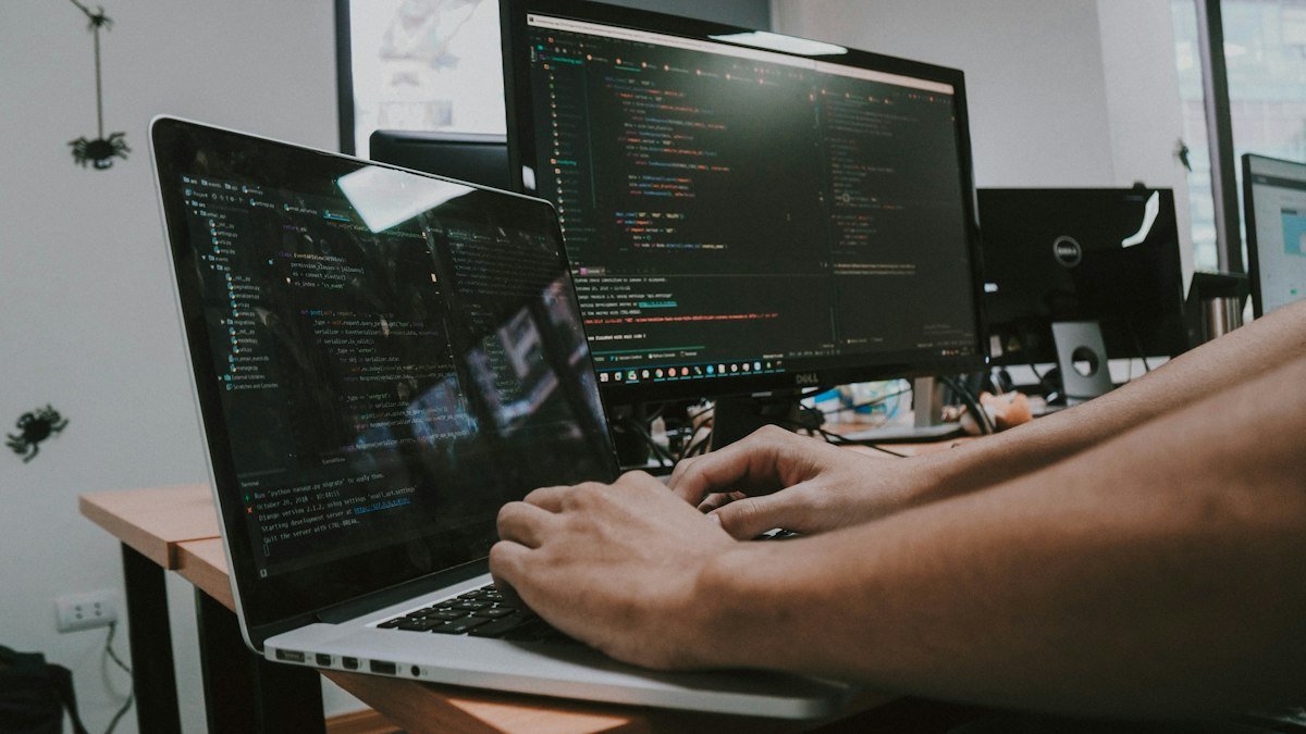 Photo by Shamin Haky on Unsplash. Source: https://unsplash.com/photos/a-person-typing-on-a-laptop-computer-on-a-desk-Uhx-gHPpCDg (Unsplash License).