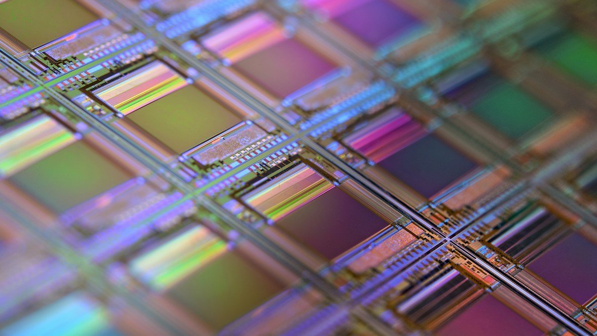 Photo by Laura Ockel on Unsplash. Source: https://unsplash.com/photos/silicon-wafer-with-iridescent-microchip-grid-qOx9KsvpqcM (Unsplash License).