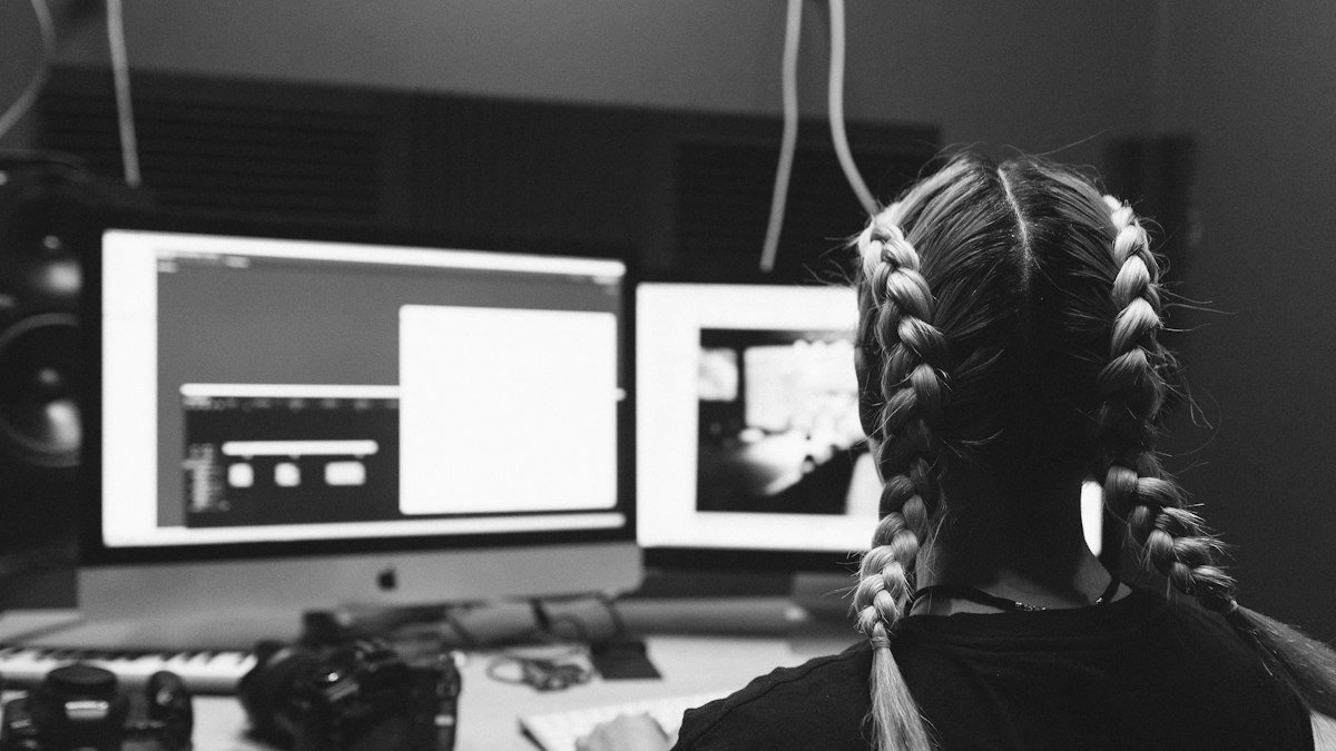 Photo by Ofspace LLC on Unsplash. Source: https://unsplash.com/photos/a-man-sitting-in-front-of-two-computer-monitors-ZTLUNxoRaPY (Unsplash License).