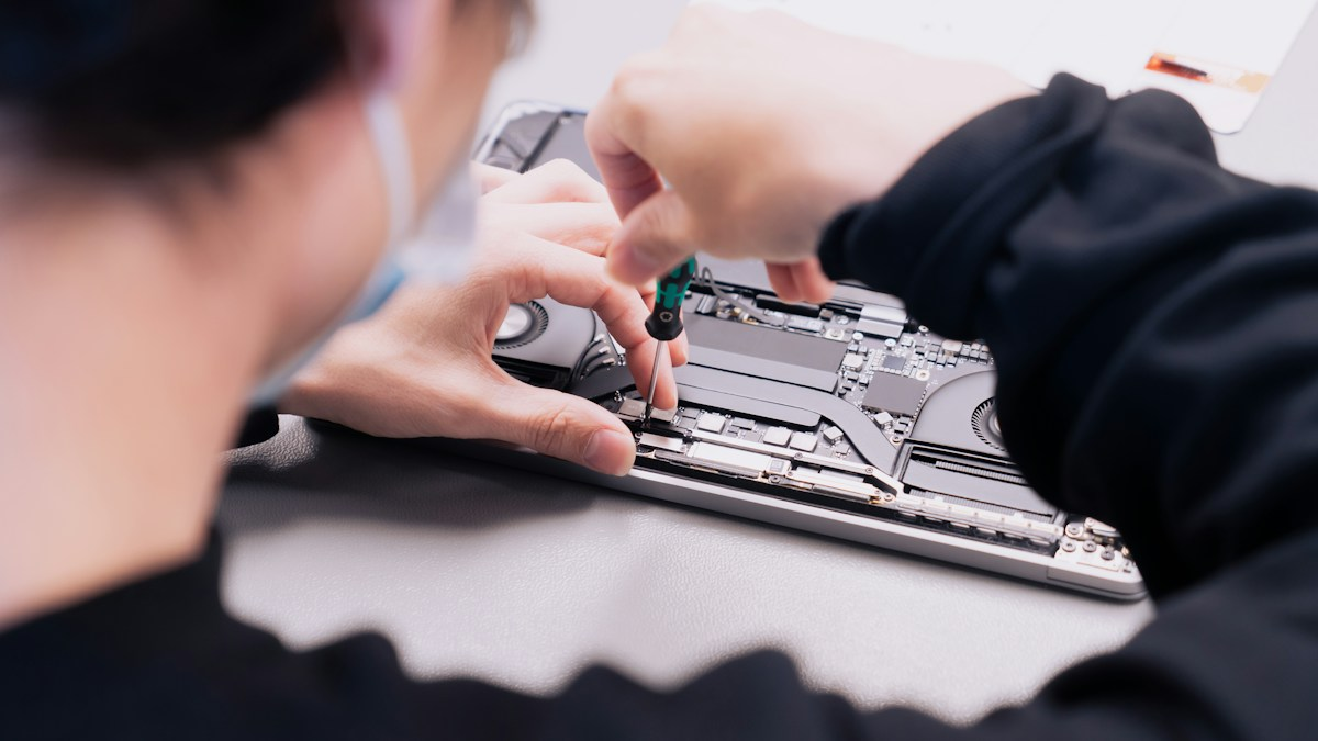 Photo by Revendo on Unsplash. Source: https://unsplash.com/photos/a-woman-is-working-on-a-laptop-with-her-hands-TN0dhAnylPI (Unsplash License).