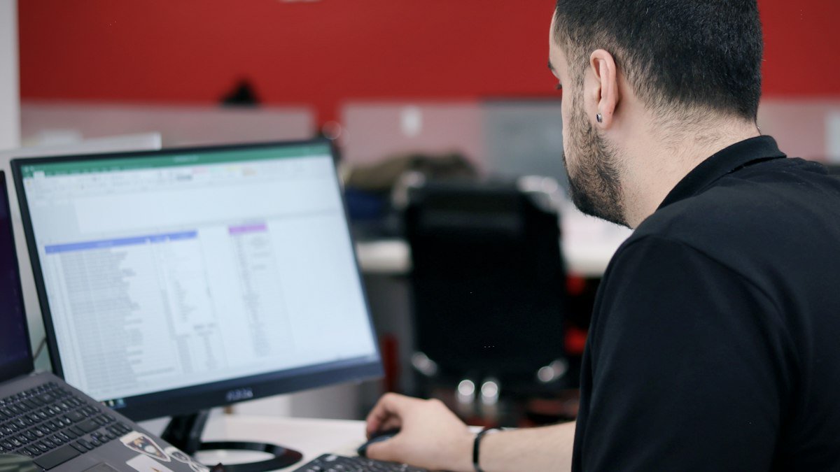 Photo by Omid Ajorlo on Unsplash. Source: https://unsplash.com/photos/a-man-sitting-in-front-of-a-laptop-computer-zqDmGpODmSI (Unsplash License).