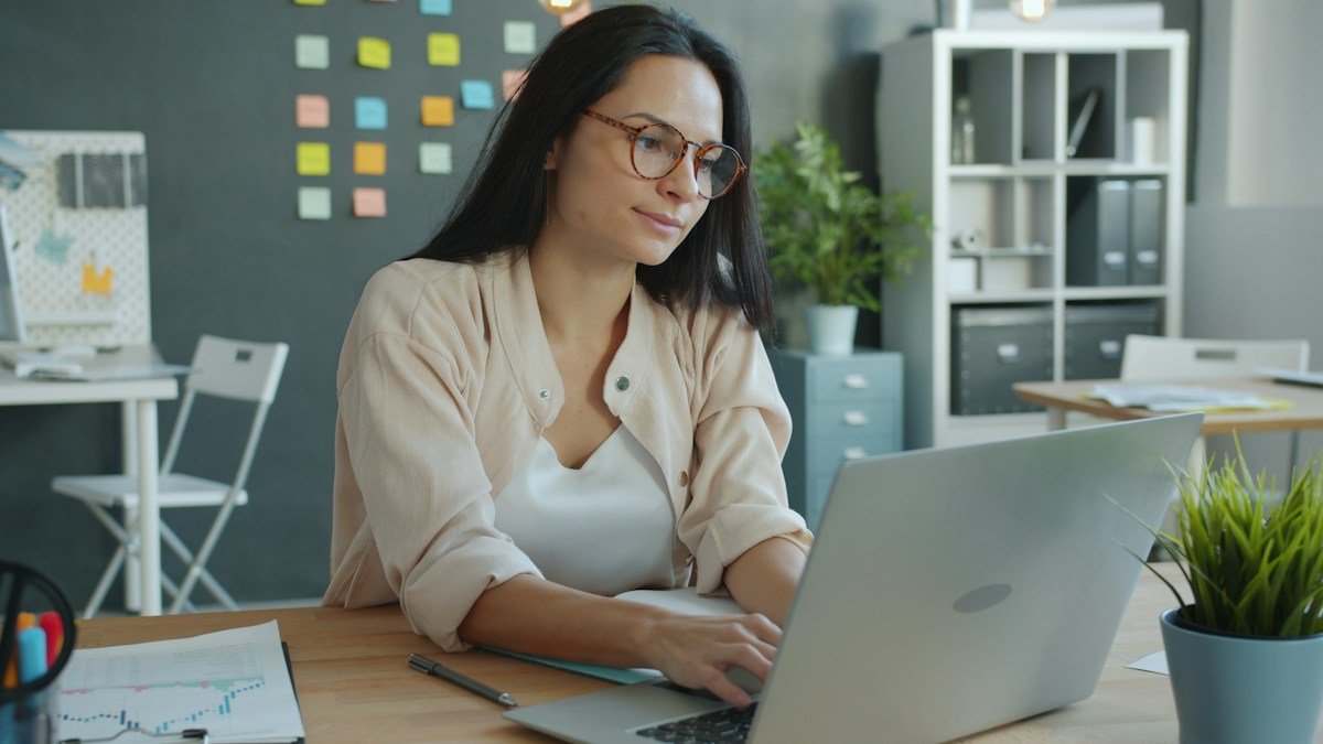 Photo by Vitaly Gariev on Unsplash. Source: https://unsplash.com/photos/woman-working-on-laptop-in-modern-office-setting-O9PEo38zOss (Unsplash License).