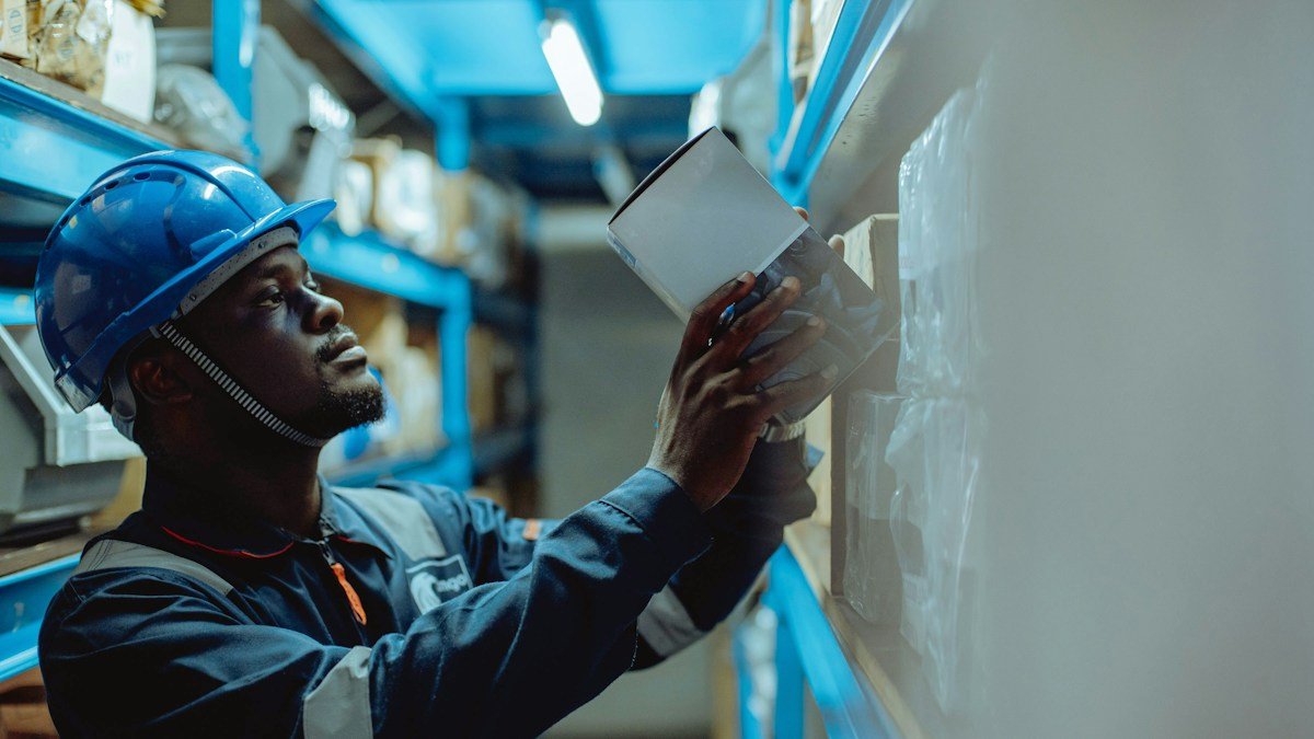 Photo by Ali Mkumbwa on Unsplash. Source: https://unsplash.com/photos/a-man-in-a-hard-hat-is-looking-at-a-piece-of-paper-N_nAAwnBDy8 (Unsplash License).
